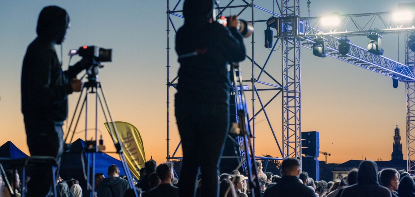 Cameramen Capturing Moments at a Live Event