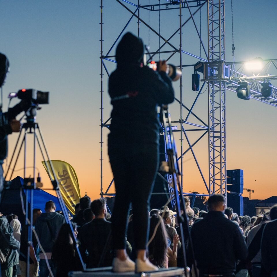 Cameramen Capturing Moments at a Live Event